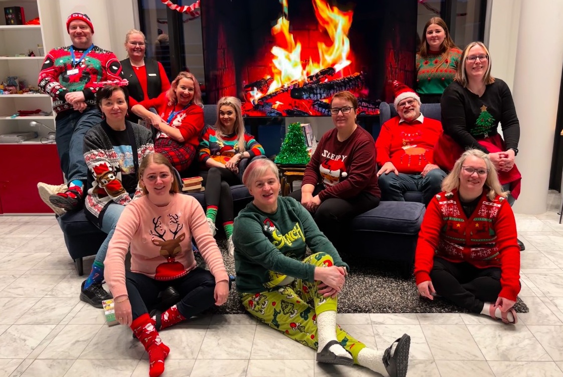 Picture of the Municipal Library's staff in Christmas clothes
