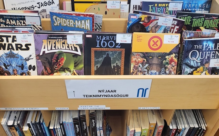 Book shelves with comic books in them
